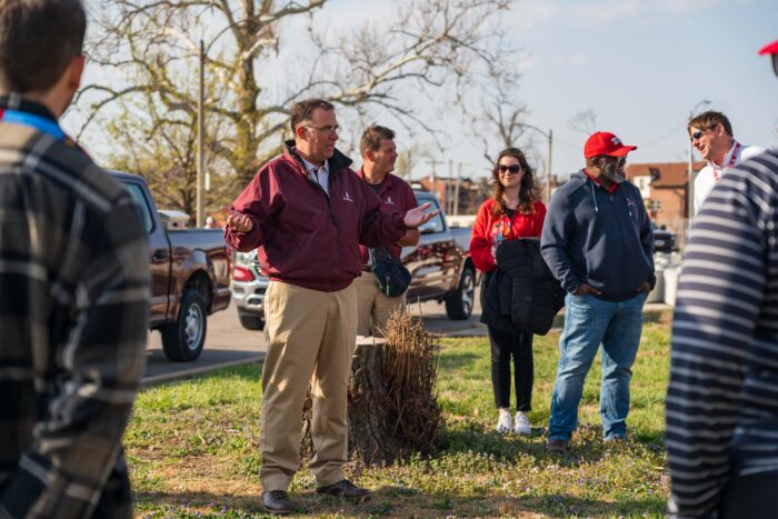 John Munie speaks to a crowd gathered to volunteer at Focal Pointe's Broken Bat planting event